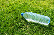 Photo: plastic water bottle on grass plastic water bottle on grass