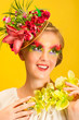 Beautiful young girl with creative flower cap and orchid flower