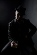 Worried man sitting with a whiskey glass