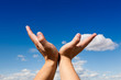 Photo: oupen hand against blue sky oupen hand against blue sky
