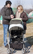 Happy Family Walking with Stroller