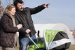 Photo: Happy Family Walking with Stroller Happy Family Walking with Stroller