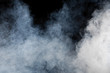 White smoke on black background. Isolated.