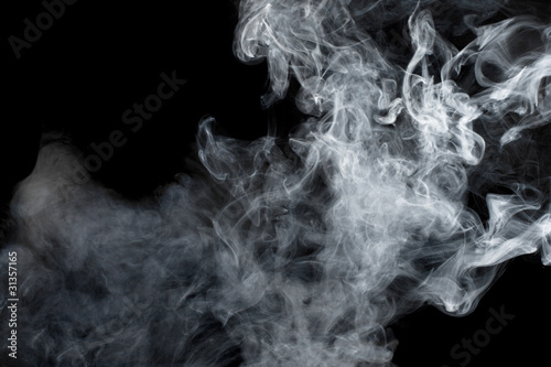 Photo: White smoke on black background. Isolated. White smoke on black background. Isolated.