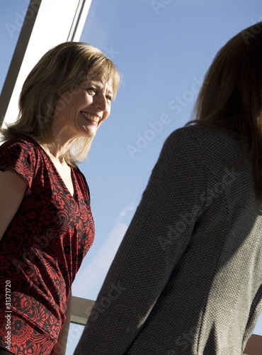 Photo: Two Women Talking Two Women Talking