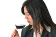 young brown woman smelling a glass of red wine young brown woman smelling a glass of red wine