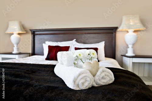Photo: Bedroom ready for guests in soft warm lighting Bedroom ready for guests in soft warm lighting