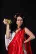 Ancient greece woman with a bunch of grapes