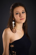 Portrait of young woman in blue dress