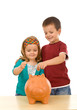Kids saving coins in large piggy bank