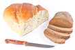 White bread loaf and sliced loaf of rye bread with knife