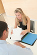 Credit adviser showing document to buyer