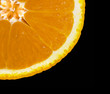 Slice of orange isolated over black Slice of orange isolated over black