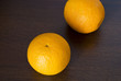 Two oranges on the wooden table Two oranges on the wooden table