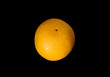 Single orange isolated over black Single orange isolated over black