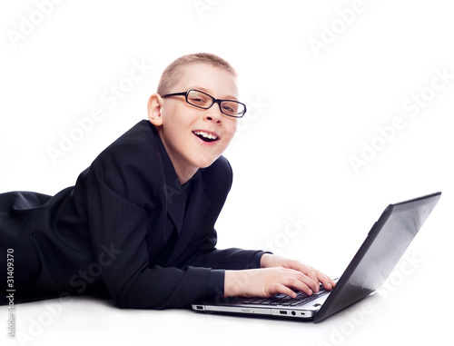 Photo: boy with a laptop boy with a laptop