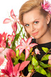 Portrait of young beautiful woman holding flowers