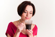 Young woman with a cup of hot drink