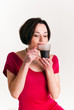 Young woman with a cup of hot drink