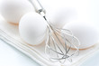 Whisk and fresh eggs