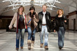 Foto: Four commuters in a train station Four commuters in a train station