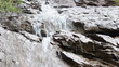 Small waterfall flowing down the rocks. Small waterfall flowing down the rocks.