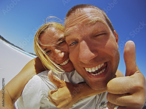 Photo: Couple Having Fun On The Beach Couple Having Fun On The Beach