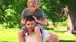 Young boy on his father's shoulders