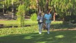 Mature couple running outdoors