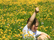 young boy in buttercup field