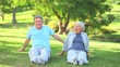 Mature couple doing their stretches outside