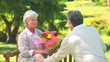 Video: Mature man offering a bunch of flowers to his wife Mature man offering a bunch of flowers to his wife