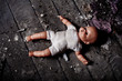 doll on dirty ground