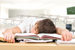 tired teenager lying and sleeping on the books