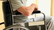 Man in a wheelchair watching something