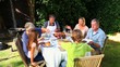 Family barbecue meal in the garden