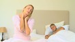 Blonde haired woman having a neck pain