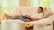  man Lying on sofa working