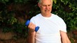 Video: Mature man exercising his arms Mature man exercising his arms