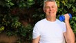 Mature man doing exercise with dumbbells