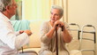 A mature patient and her doctor talking