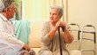 Doctor visiting a worried older  patient 