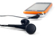 Unrecognizable phone with connected headphones Unrecognizable phone with connected headphones