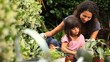 Mother and daughter gardening