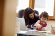 Photo: Multitasking mother with her daughter Multitasking mother with her daughter