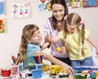 Child painting in preschool.