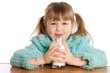 The little girl with a milk glass