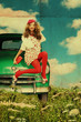 beauty young woman with curly hairs on retro green car