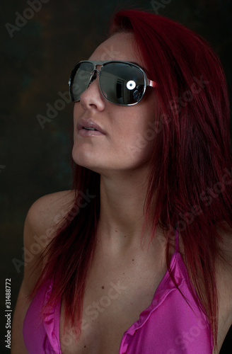 Photo: Pretty young woman in sunglasses Pretty young woman in sunglasses