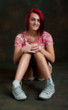 Pretty young red haired woman relaxing